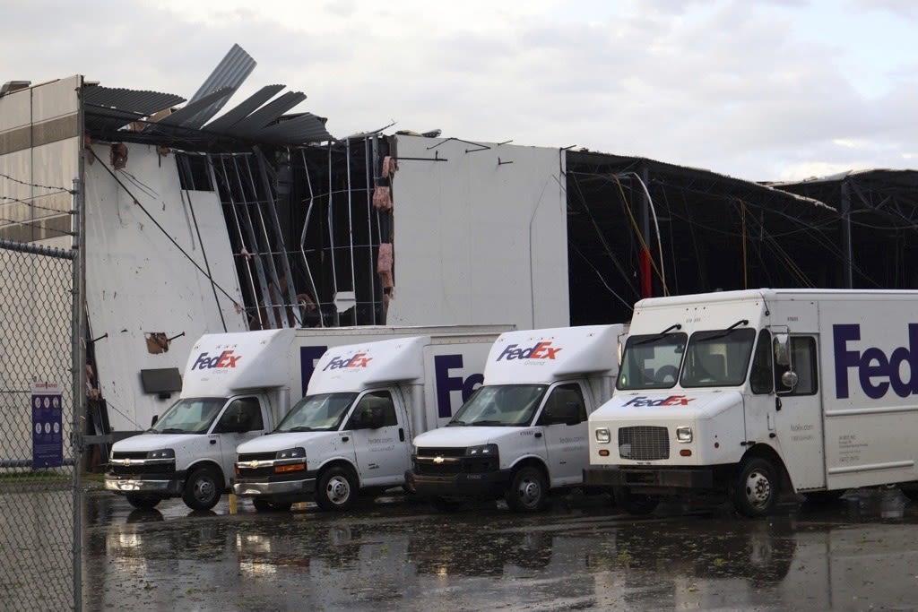 Severe storms batter the Midwest, including reported tornadoes that shredded a FedEx facility