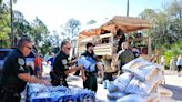 Volusia sheriff's deputies drop off water, meals and pet food to flooded Mims residents