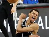 Victor Wembanyama celebrates after leading San Antonio to a victory over Denver last month