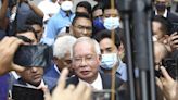Malaysia's top court upholds graft conviction of ex-premier, who is taken to prison