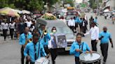 Hundreds mourn gang killings of Haitian mission director and young US couple