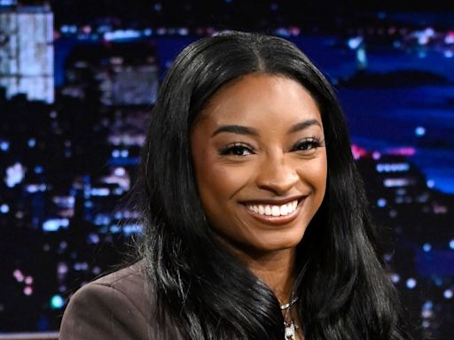 Simone Biles poses in stunning little black dress while looking back on time with husband Jonathan Owen