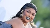 Lizzo Flaunts Curves in Swirly Swimsuit in Tropical Vacation Photos