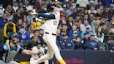 Milwaukee's Christian Yelich leaves the game in the second inning at Baltimore with back discomfort