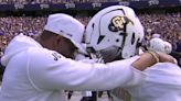 Deion Sanders and Son Shilo Share Heartwarming Embrace Before Colorado Debut and Win