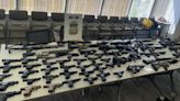 Authorities arrest man for having more than 60 firearms