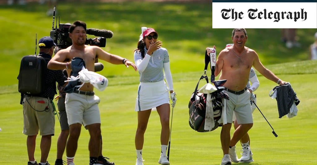 Watch: Two US caddies take tops off at Solheim Cup