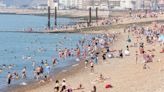 Brits flock to beaches as temps reach 31C... but Met Office issues warning