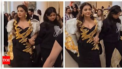 Aaradhya Bachchan SPOTTED helping injured mom Aishwarya Rai Bachchan make her way to Cannes red carpet - WATCH | - Times of India