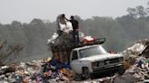 Turning to garbage dumps to survive, Argentines feel the pain of 100% inflation