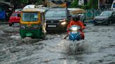 A tropical storm floods villages and cuts power to millions in parts of Bangladesh and India