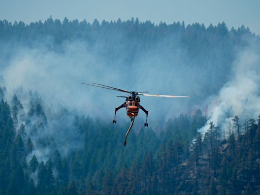 Wildfires in Colorado burn dozens of homes and structures, threaten hundreds more