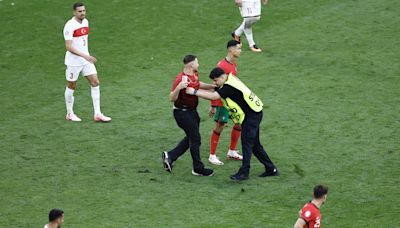 ‘It is a concern, today we were lucky”: Martinez calls for fans to stay in stands as pitch invaders swarm Ronaldo