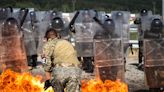 Fiery photos show US soldiers getting hit with Molotov cocktails as they train to tackle even the most intense riots