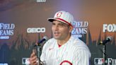 Injured Reds star Joey Votto spends time with fans in the stands during game vs. Red Sox