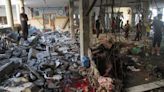 Scores reported dead in Gaza school shelter as Israel says it bombed militants