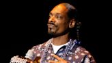 Snoop Dogg greeted by bagpipes playing his song as he lands in Scotland