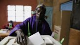 In hope or despair, Kenyans choose new president from familiar faces