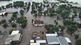 Helicopters scramble to rescue people in flooded Iowa town while much of US toils again in heat