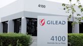 Gilead posts quarterly loss on acquisition charge, revenue rises 5%