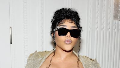 Lil' Kim joins Christian Siriano's NYFW front row fashionably late, mid-fashion show