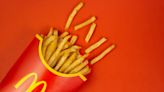 McDonald's employee dries wet mop under heat lamp over french fries