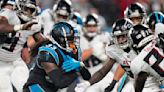 Foreman leads Panthers past rival Falcons in rain, 25-15