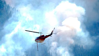 Wildfires encroach on homes near Denver as heat hinders fight