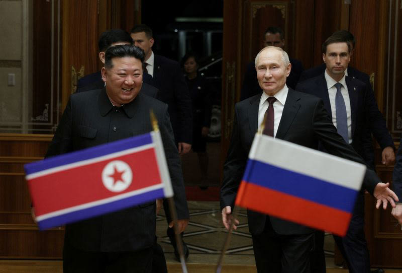 Putin flies into North Korea with promise to back it against the US