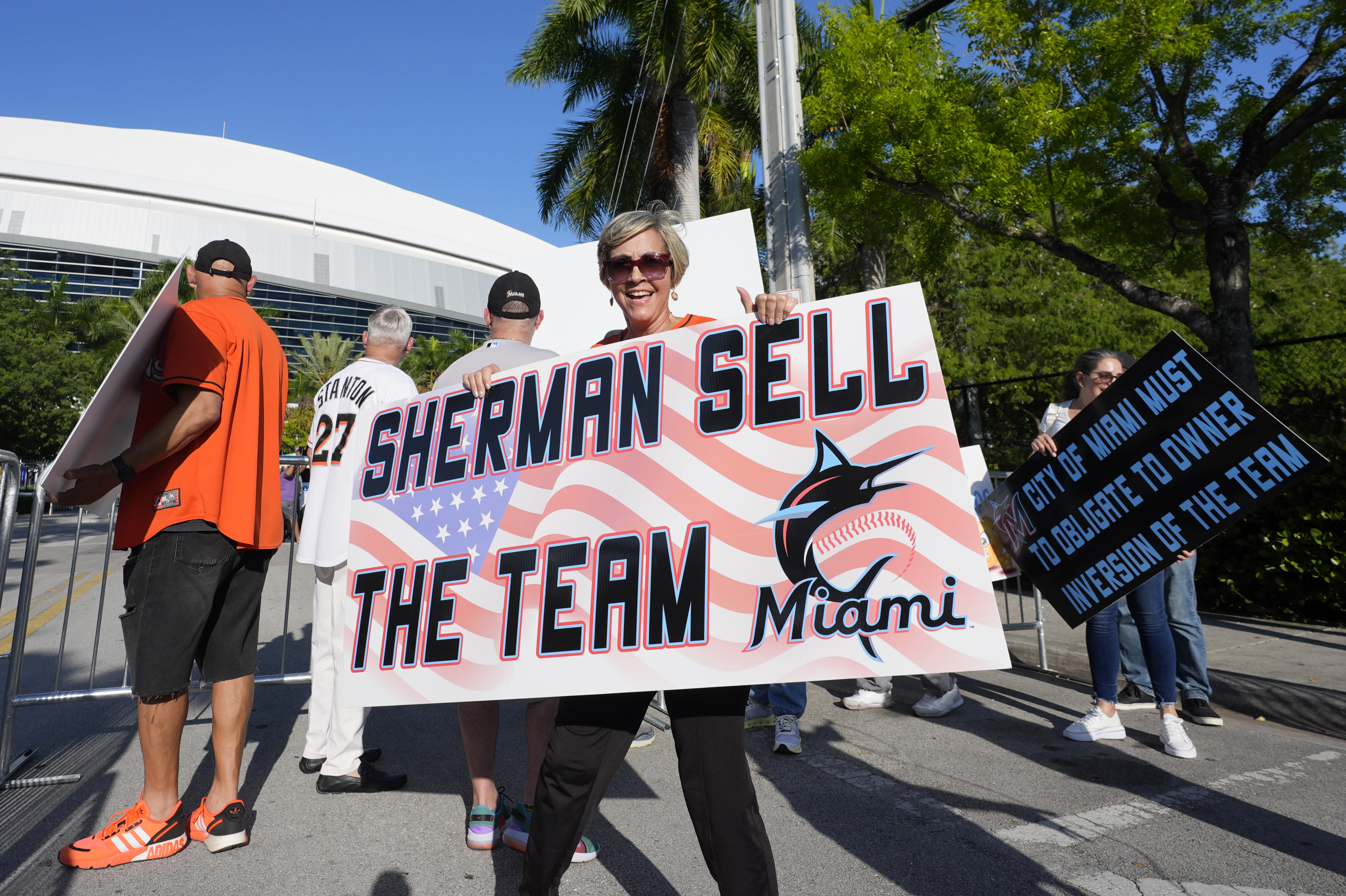 A handful of disgruntled Marlins fans protest the team following the Luis Arraez trade