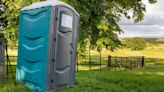 Man accused of pushing over porta-potty with woman, child inside