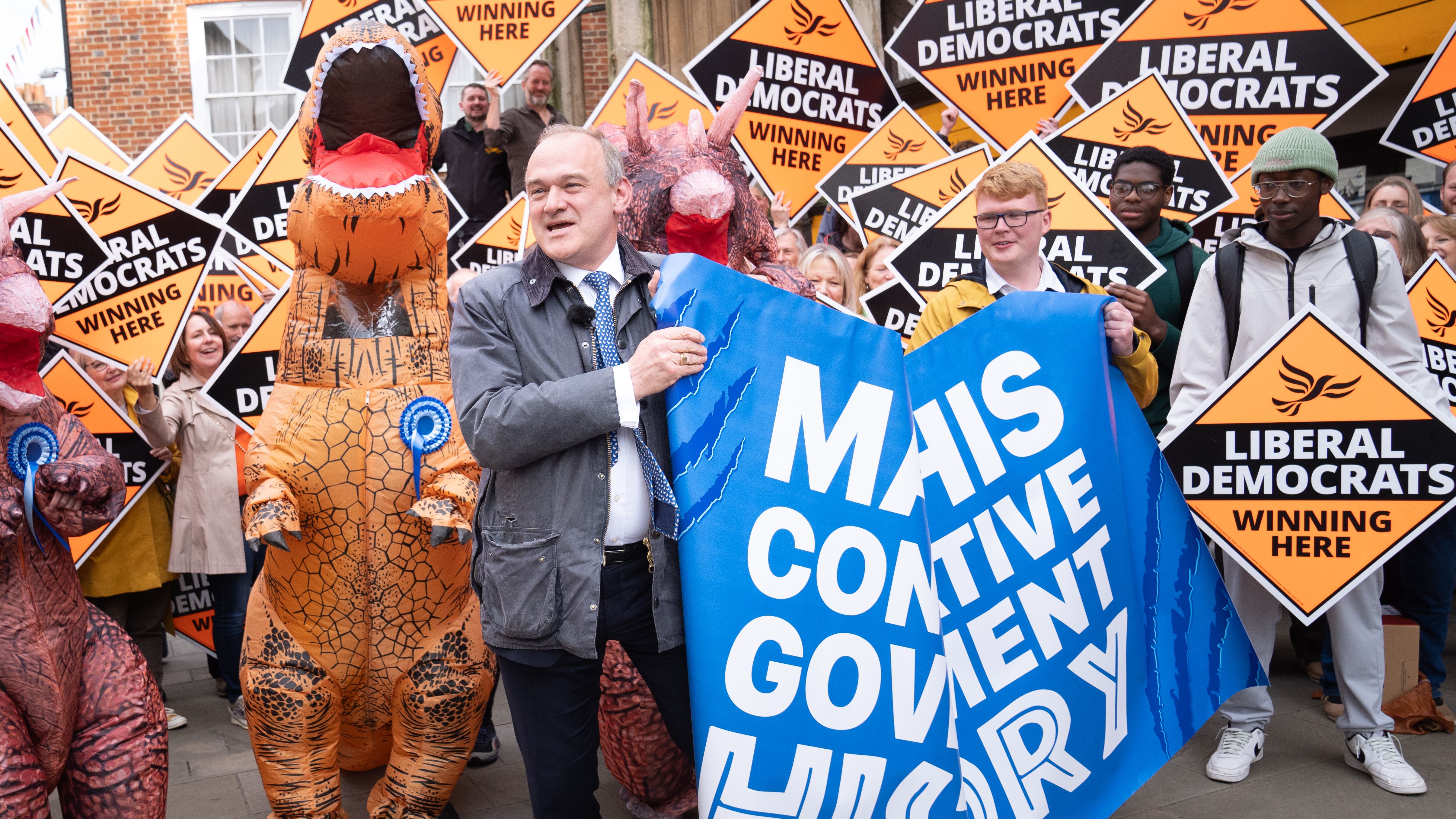 Sir Ed Davey poses with ‘Tory dinosaurs’ in latest election campaign stunt