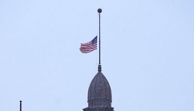 Why are the flags flying at half-staff in Wisconsin on Sunday?