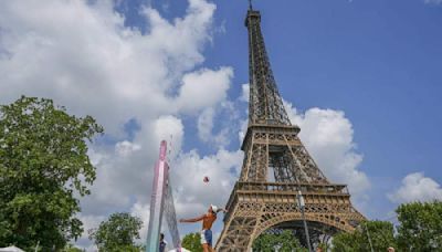 Beach volleyball at Eiffel Tower stadium draws the crowds looking for the perfect social media post