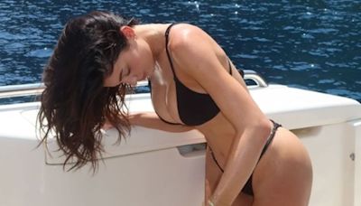 Kylie Jenner shows off her incredible physique in a tiny black bikini