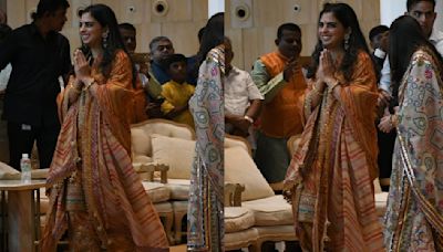 Isha Ambani embodies pre-wedding spirit in this stunning orange suit adorned with intricate golden details