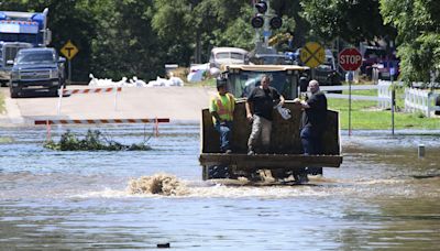 Bridge collapses into Iowa river after heavy flooding