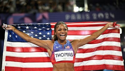 Underdog Thomas scales Olympic summit with 200m gold