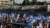 Many mourners at Chanan Yablonka's funeral carried Israeli flags