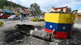 Hugo Chavez statues toppled across Venezuela in post-election unrest