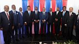 Haiti transitional government takes power as gangs hold capital 'hostage'