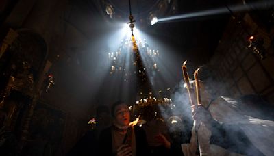 Cheers and flames as Orthodox worshipers greet the ancient ceremony of the 'Holy Fire'