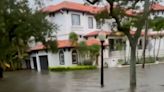 Floodwater rushes down Tampa street after Hurricane Idalia makes Florida landfall