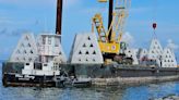 What are those hundreds of concrete pyramids doing at the Skyway bridge fishing pier?