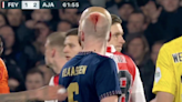 Man arrested after Davy Klaassen left with gashed head by thrown lighter in bad-tempered Ajax derby