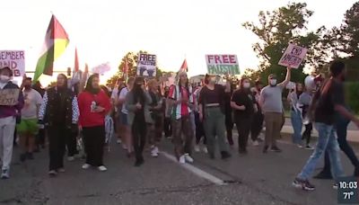 Anti-war protesters march through St. Louis streets near Washington University