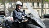 Candidate for the French Socialist Party 2012 primary elections, Francois Hollande is pictured on his scooter in Paris in 2011