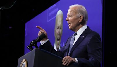 Biden pledges 'I am all in,' criticizes Trump on policy