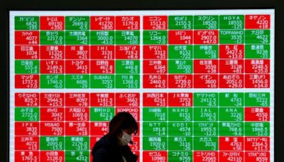 Asian shares mostly higher, yen hits record low versus euro