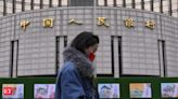 China makes surprise cut to key lending rate - The Economic Times